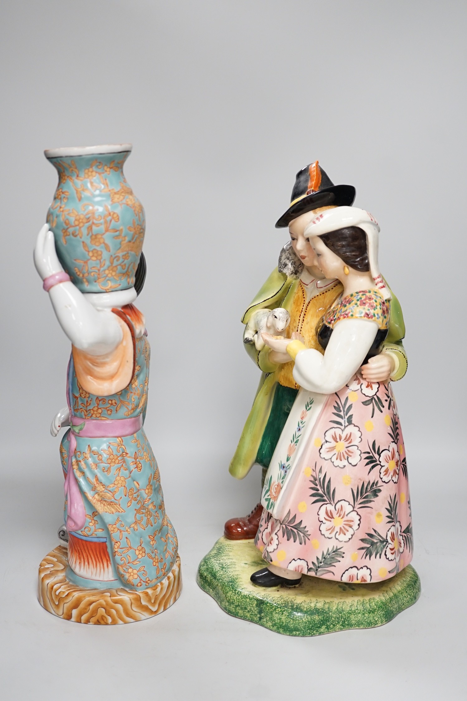 A Chinese porcelain figure of a lady together with a continental porcelain figure group, tallest 38cm